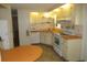 Efficient kitchen featuring cabinets, countertops, and standard appliances for a functional cooking experience at 705 Blackburn Blvd, North Port, FL 34287