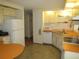 Functional kitchen featuring appliances, ample counter space, and neutral cabinetry for a cozy cooking environment at 705 Blackburn Blvd, North Port, FL 34287