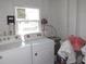 Practical laundry room with essential appliances for convenient chores and household tasks at 705 Blackburn Blvd, North Port, FL 34287