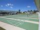 Enjoy a game of shuffleboard on these well-maintained courts under a sunny sky, enhancing community living at 705 Blackburn Blvd, North Port, FL 34287