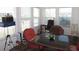 Bright sunroom with a table and chairs and many windows providing ample natural light at 705 Blackburn Blvd, North Port, FL 34287