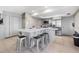 This spacious kitchen has an island with seating and modern, stainless steel appliances at 7205 Wood Creek Dr # 16, Sarasota, FL 34231
