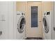 Bright laundry room featuring side-by-side washer and dryer units and natural light at 7205 Wood Creek Dr # 16, Sarasota, FL 34231
