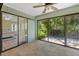 Bright sun room with tile flooring and sliding glass door access to the bedroom and backyard at 7205 Wood Creek Dr # 16, Sarasota, FL 34231