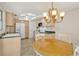 Well-lit kitchen with light-colored cabinetry, modern appliances, and spacious dining area at 7542 Swanson Ln, Sarasota, FL 34231