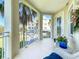 Enjoy the outdoors on this balcony with white wicker seating, a door to the inside, and views of the surrounding property at 7810 34Th W Ave # 103, Bradenton, FL 34209
