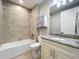 Bathroom with tub, shower and granite countertop at 7810 34Th W Ave # 103, Bradenton, FL 34209