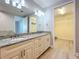 Bathroom with double sinks, granite countertops and access to a walk-in closet at 7810 34Th W Ave # 103, Bradenton, FL 34209