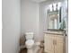 Bathroom with granite countertop, white vanity and tile flooring at 7810 34Th W Ave # 103, Bradenton, FL 34209