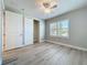 Bright bedroom featuring wood-look flooring, a ceiling fan and natural light from the window at 7810 34Th W Ave # 103, Bradenton, FL 34209