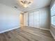 Light and bright bedroom with wood-look floors, closet and adjoining entry at 7810 34Th W Ave # 103, Bradenton, FL 34209