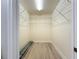 Walk-in closet with wooden floors and wire shelving for optimal storage at 7810 34Th W Ave # 103, Bradenton, FL 34209