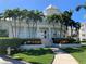 Attractive clubhouse with beautiful landscaping and a grand entrance, surrounded by palm trees at 7810 34Th W Ave # 103, Bradenton, FL 34209