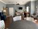Inviting common area featuring multiple round tables, cushioned chairs, and a built-in buffet with TV at 7810 34Th W Ave # 103, Bradenton, FL 34209