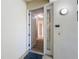 Inviting entryway features a welcome mat, stylish light fixture, and a glimpse into the home's interior at 7810 34Th W Ave # 103, Bradenton, FL 34209