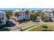 Exterior shot of residential buildings featuring balconies, palm trees, and well-maintained green spaces at 7810 34Th W Ave # 103, Bradenton, FL 34209