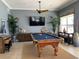 Community game room with a pool table, seating, decor and a large flatscreen television at 7810 34Th W Ave # 103, Bradenton, FL 34209