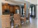 Kitchen with stainless steel appliances, wood cabinetry, and breakfast bar seating at 7810 34Th W Ave # 103, Bradenton, FL 34209