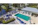 Aerial view of the community pool featuring lounge chairs, tables, and chairs for outdoor relaxation at 7810 34Th W Ave # 103, Bradenton, FL 34209