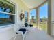 Inviting porch with seating and view of landscape at 7810 34Th W Ave # 103, Bradenton, FL 34209
