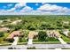 This aerial view of the property shows its location, lush landscaping, and backyard at 8449 Lone Eagle Way, Sarasota, FL 34241