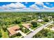 Wide aerial view of the neighborhood showcasing the community homes with large green backyards at 8449 Lone Eagle Way, Sarasota, FL 34241