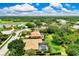 Aerial view of property with screened-in pool in a community near a golf course at 8449 Lone Eagle Way, Sarasota, FL 34241