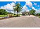 Misty Creek's gated entrance, featuring lush landscaping and providing security and a grand welcome at 8449 Lone Eagle Way, Sarasota, FL 34241