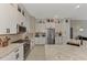 Modern kitchen featuring white cabinets, granite countertops, and stainless appliances at 8449 Lone Eagle Way, Sarasota, FL 34241