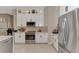 Well-appointed kitchen featuring stainless appliances and stylish white cabinetry at 8449 Lone Eagle Way, Sarasota, FL 34241