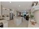 Open-concept kitchen with stainless steel appliances and a central island at 8449 Lone Eagle Way, Sarasota, FL 34241