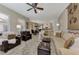 Spacious open-concept living room showcasing the seamless flow into the kitchen and dining areas at 8449 Lone Eagle Way, Sarasota, FL 34241