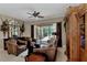 Inviting living area with comfortable seating, natural light, and seamless access to the outdoor pool area at 8449 Lone Eagle Way, Sarasota, FL 34241
