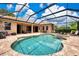 Inviting backyard pool and brick paved patio, enclosed by a screened lanai, offers a luxurious outdoor space at 8449 Lone Eagle Way, Sarasota, FL 34241