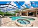 Backyard pool with spa, brick pavers, and screened lanai, great for entertaining outdoors at 8449 Lone Eagle Way, Sarasota, FL 34241