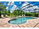 Inviting screened-in pool and spa area with lounge chairs for relaxing outdoors at 8449 Lone Eagle Way, Sarasota, FL 34241