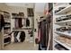 A well-organized walk-in closet with shelving and hanging storage for clothes, shoes, and accessories at 8449 Lone Eagle Way, Sarasota, FL 34241