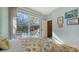 Bright bedroom with a sliding glass door leading to a private pool area at 8504 Woodbriar Dr, Sarasota, FL 34238