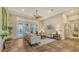 Spacious living room featuring tile floors, neutral decor, and a view of the pool area at 8504 Woodbriar Dr, Sarasota, FL 34238