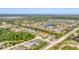 Expansive aerial view of a residential community with lush greenery, ponds, and well-spaced homes at 909 143Rd Ne St, Bradenton, FL 34212