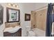 Bathroom featuring a vanity with a unique sink, framed mirror, and a shower-tub combination at 909 143Rd Ne St, Bradenton, FL 34212