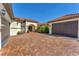 Beautiful home with brick paver driveway, three-car garage and stone-accented entry at 909 143Rd Ne St, Bradenton, FL 34212
