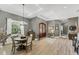 Spacious foyer featuring wood floors, a decorative front door, and neutral wall colors at 909 143Rd Ne St, Bradenton, FL 34212