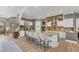 Bright kitchen with a central island and granite countertops, complemented by stainless steel appliances at 909 143Rd Ne St, Bradenton, FL 34212