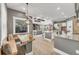 Inviting kitchen with eat-in breakfast nook offering natural light, granite countertops, and wood floors at 909 143Rd Ne St, Bradenton, FL 34212