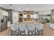Spacious kitchen featuring a central island, granite countertops, stainless steel appliances and white cabinets at 909 143Rd Ne St, Bradenton, FL 34212