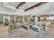 Spacious living room with exposed beams, open floor plan and view of kitchen at 909 143Rd Ne St, Bradenton, FL 34212