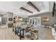 Large living room featuring wood beam ceiling, open concept design and stylish decor at 909 143Rd Ne St, Bradenton, FL 34212