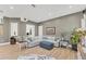 Bright living room featuring a large sofa, neutral tones, and plenty of natural light at 909 143Rd Ne St, Bradenton, FL 34212