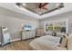 Serene main bedroom showcasing wood floors, natural light, and ample closet space at 909 143Rd Ne St, Bradenton, FL 34212